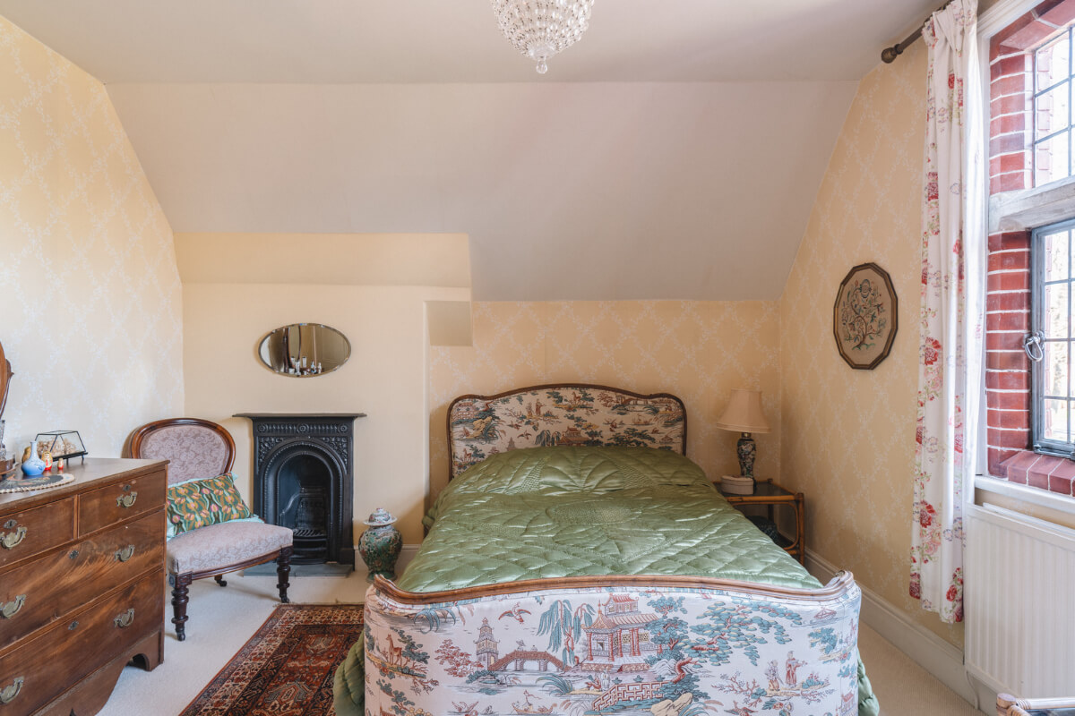 beige wallpaper bedroom antique furniture