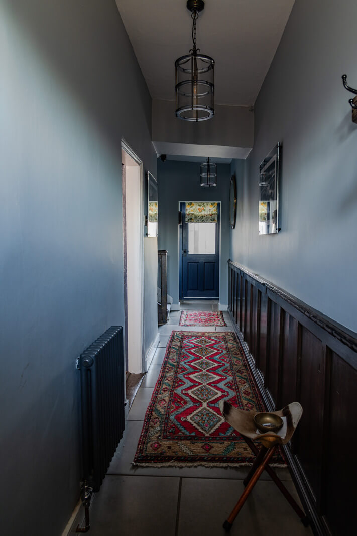 blue hallway with stone floor