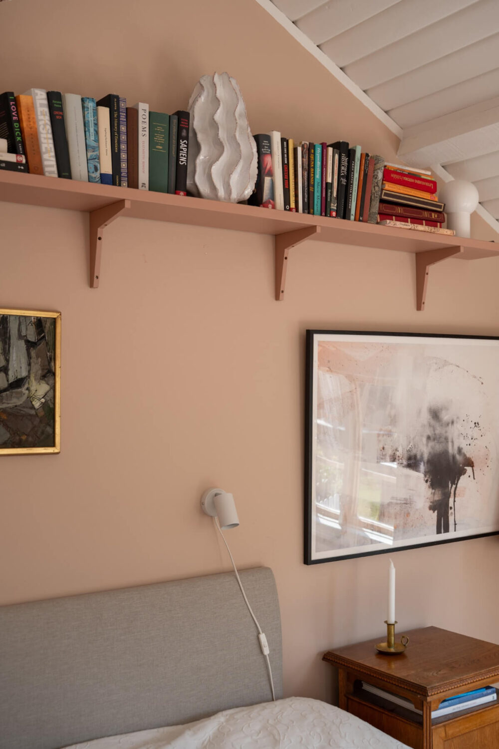 bookshelf above bed