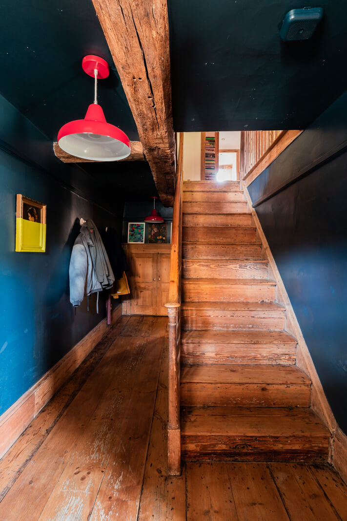 hallway wooden floor dark blue walls ceiling