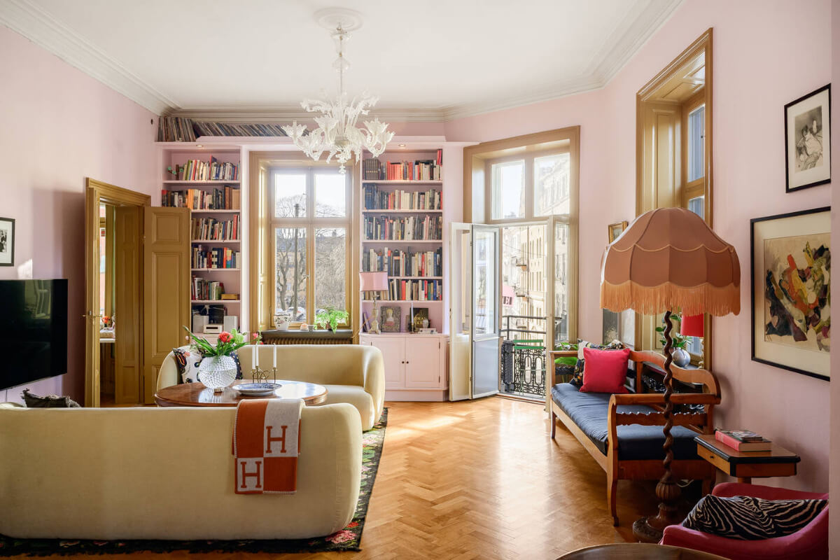living room pink walls bookcases