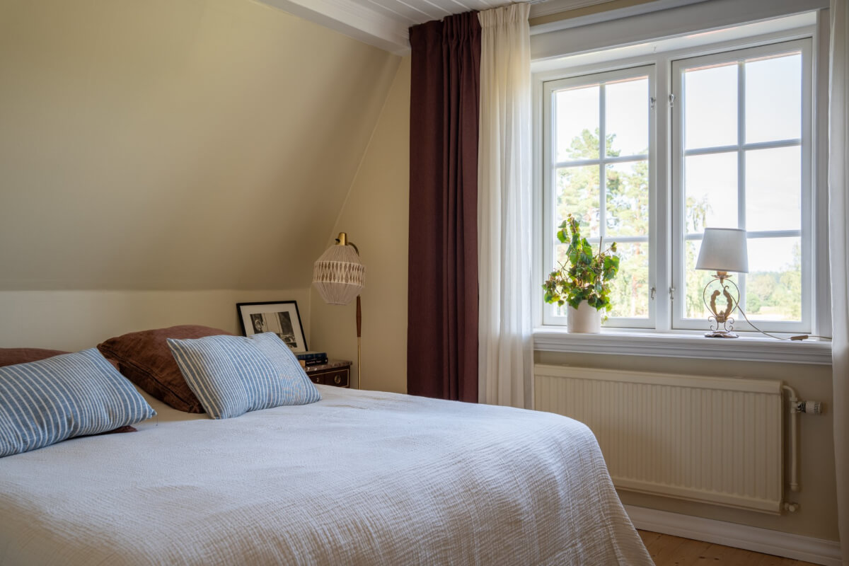 serene master bedroom slanted ceiling