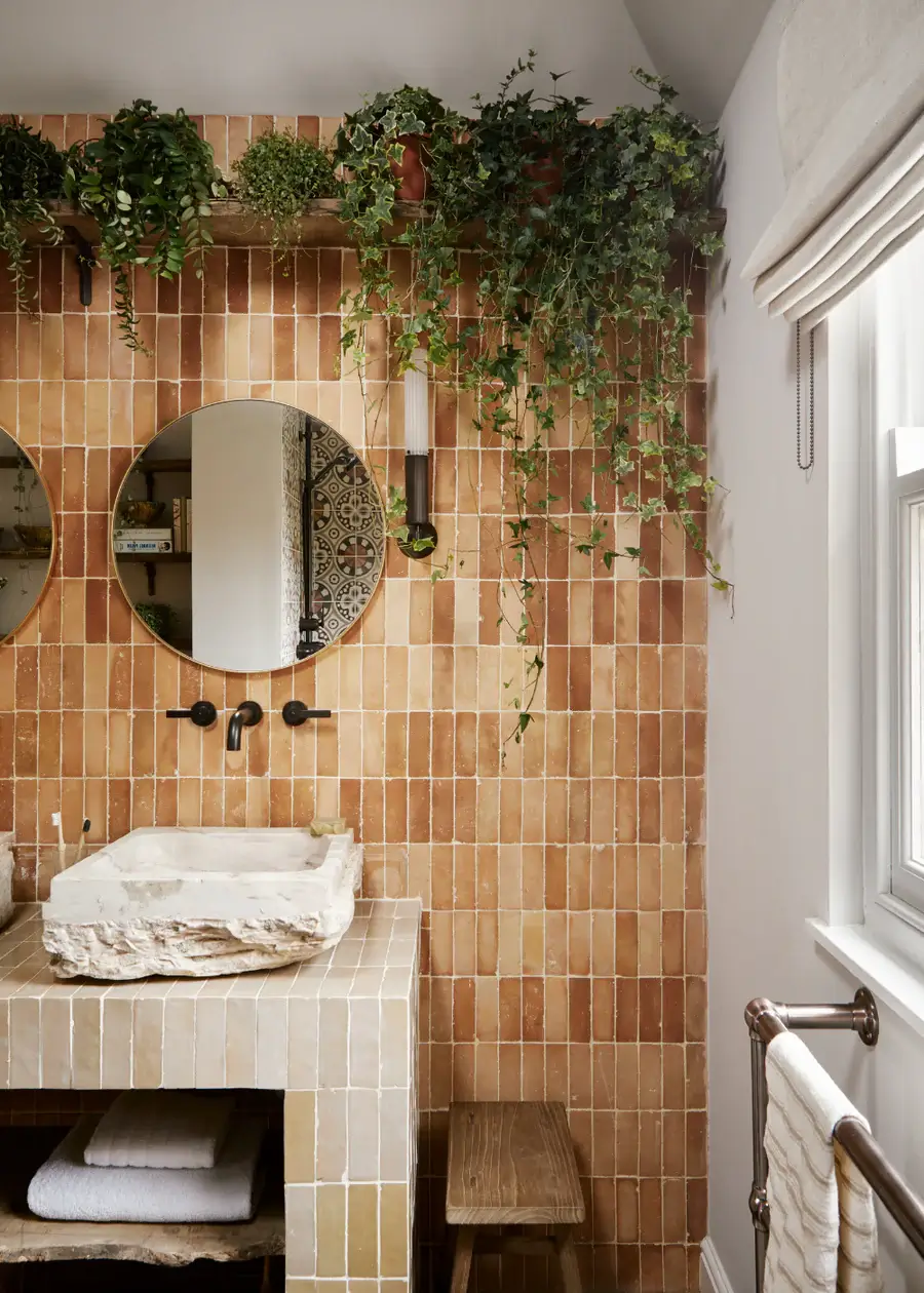 bathroom with plants and brown tiles in various hues Pantone Color of the Year 2025: Mocha Mousse Interior Inspiration